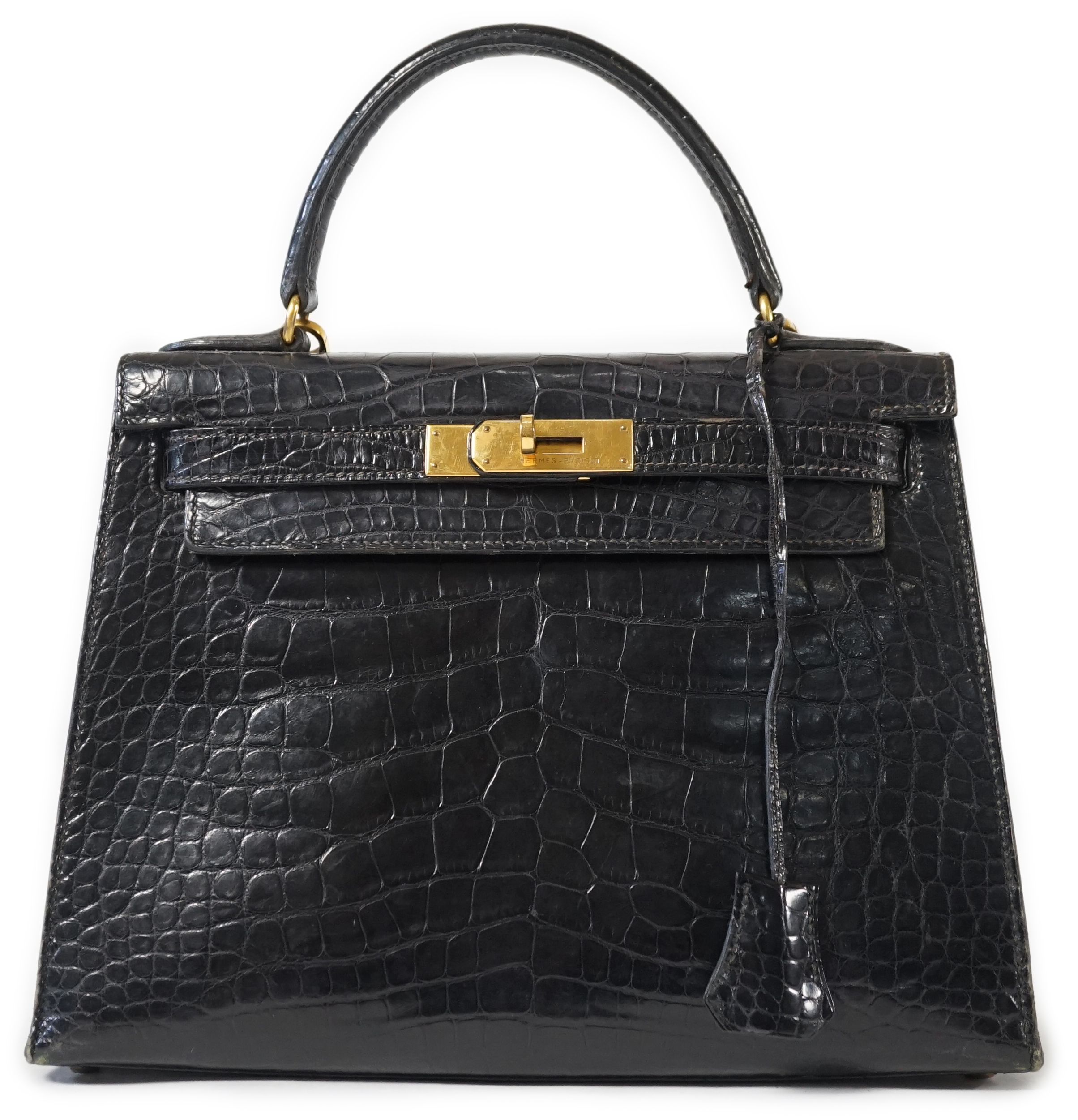 A vintage 1960's Hermès 28 Kelly in black alligator with gilt metalware, height 21cm, top of handle 31cm, width 29cm, depth 12cm